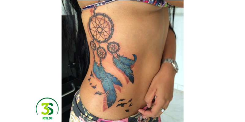 Tattoos That Make Your Waist Look Smaller: Feathered Dreamcatcher Waist Tattoos