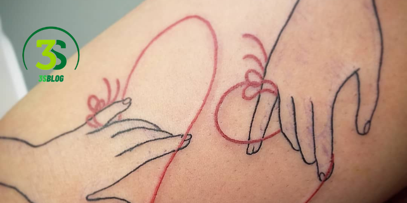red string couple tattoo